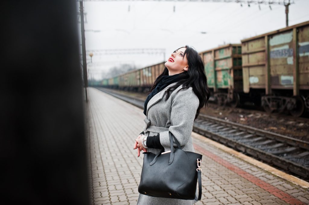 brunette-girl-in-gray-coat-posed-in-railway-statio-2025-02-11-01-27-24-utc